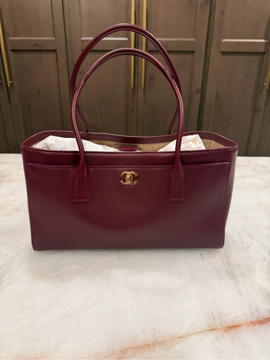 CHANEL Handbags - CHANEL Burgundy Leather Top-Handle Tote with Gold CC. New in box never used.
